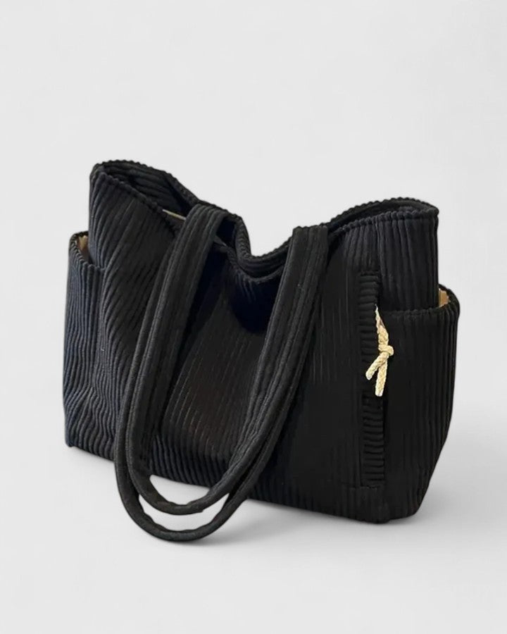 Stylish women's shoulder tote bag in rich corduroy, a versatile everyday fashion accessory.