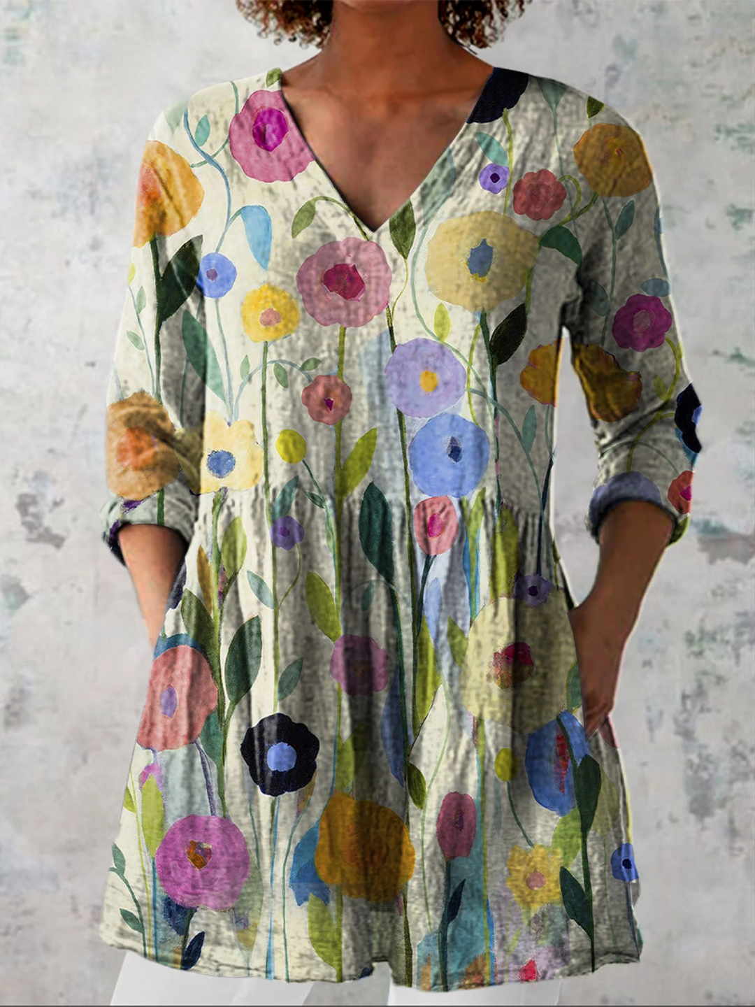 Women's multicolored fluid V-neck tunic blouse with a relaxed fit for comfortable casual wear.