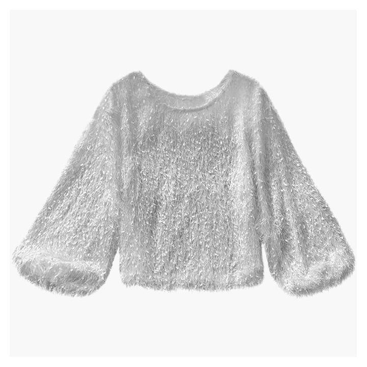 Close-up of the soft plush fabric of a women's round neck sweater, highlighting its cozy texture.