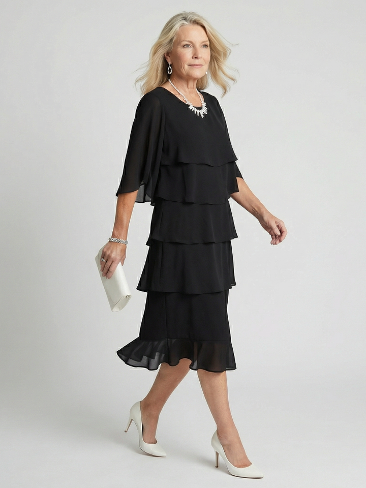 Elegant flowing midi dress for women, featuring a comfortable relaxed fit and round neck.