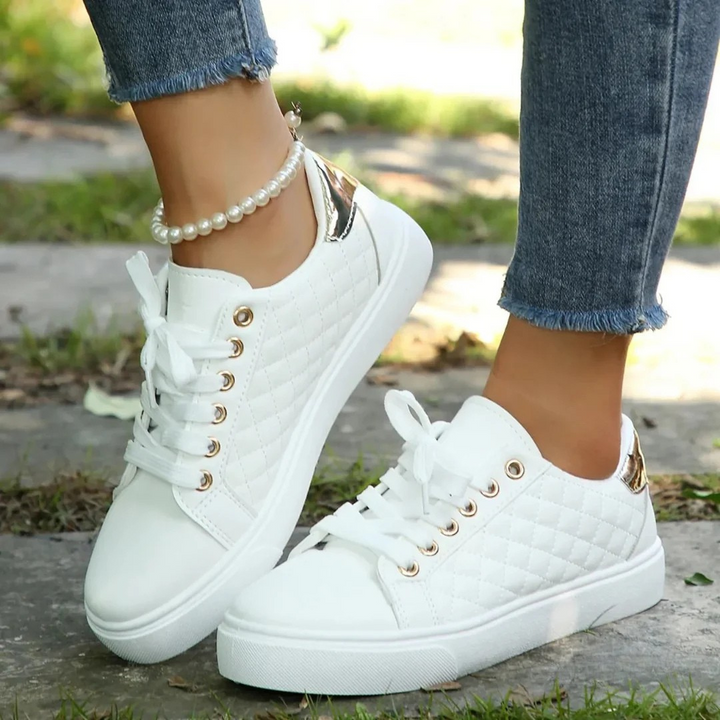 Women's orthopedic comfort walkers in white, designed for pain relief and arch support during walking.