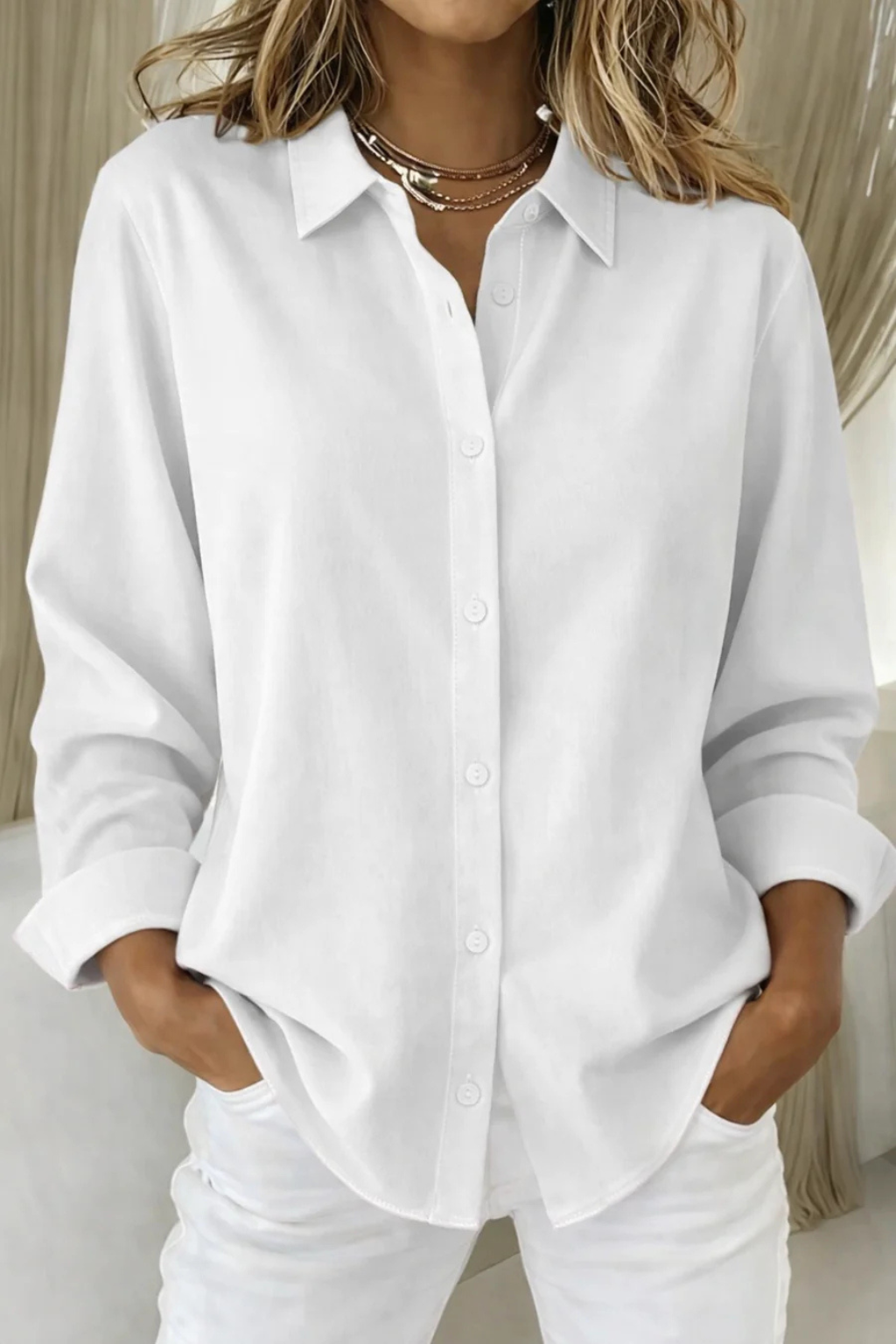 Modern women's relaxed fit collared button down shirt, long sleeves, perfect for elegant and daily looks.