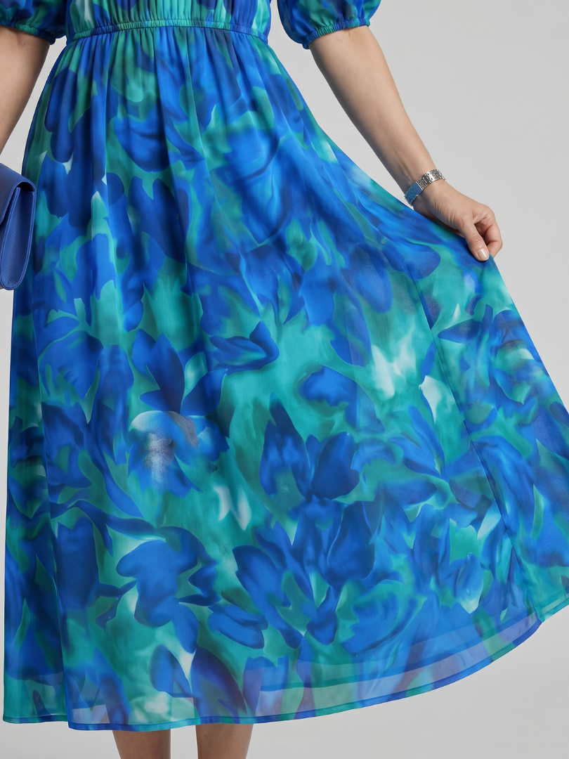 Casual women's abstract print midi dress with puff sleeves. A versatile V-neck summer dress for any occasion.
