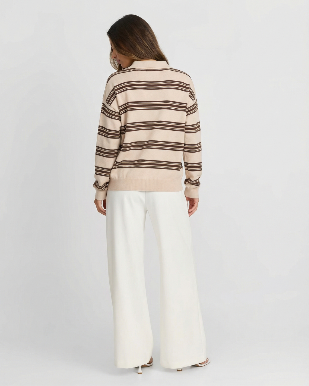 Comfortable women's long-sleeve striped polo sweater. Relaxed fit pullover knit top for everyday wear.