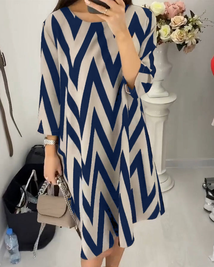 Graceful women's zigzag midi dress with loose sleeves, offering versatile fashion for any modern occasion.