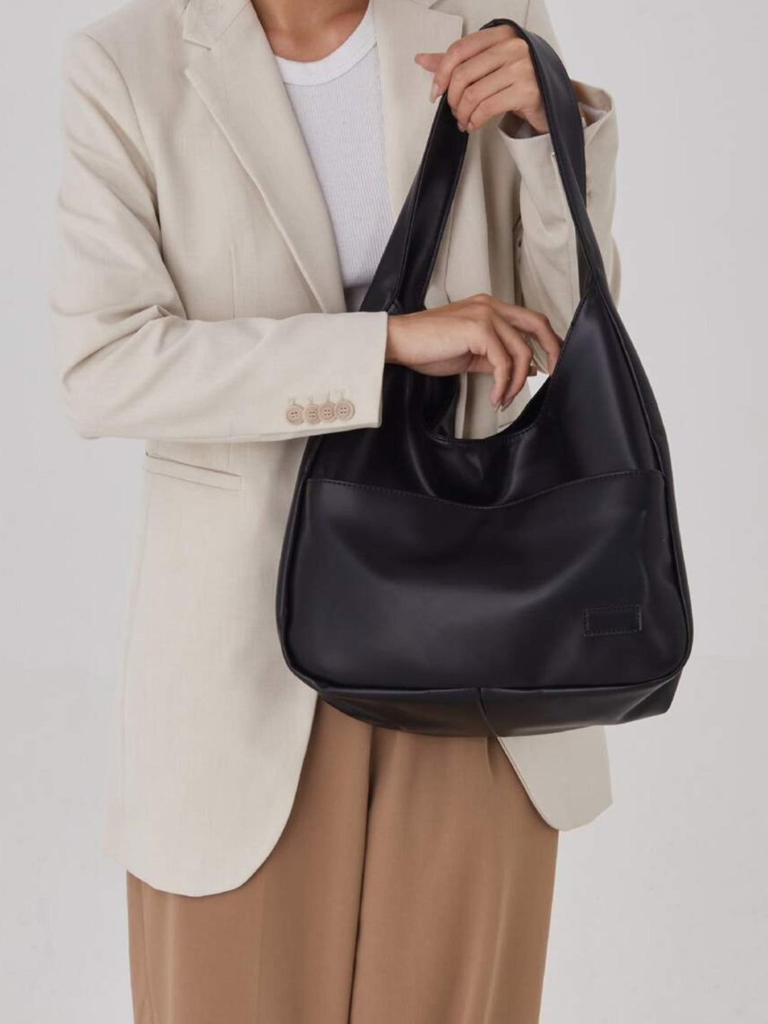 Stylish women's vegan leather shoulder bag. Versatile everyday tote, perfect for work, school & essentials.