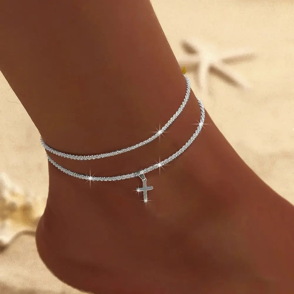 Stylish women's double layer silver & gold ankle bracelet. Chic, elegant summer jewelry accessory.