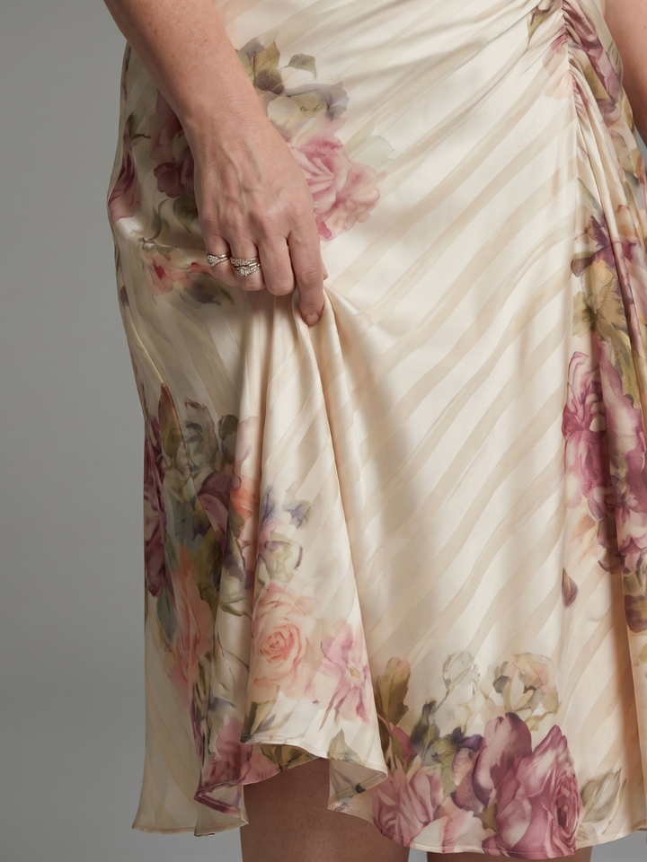 V-neck women's wrap midi dress with vibrant floral print & chic flutter sleeves; ideal for summer & occasion wear.