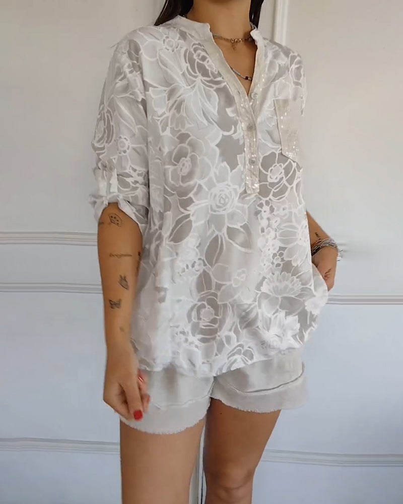 Versatile women's floral blouse with a relaxed fit, an elegant top for both casual & formal settings.