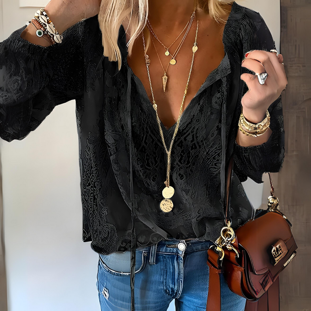 Bohemian fashion women's blouse, featuring an elegant design and trendy cutout neckline for summer style.