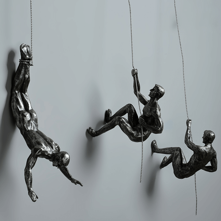 Modern climbing figures wall art sculpture set for contemporary home & office decor.