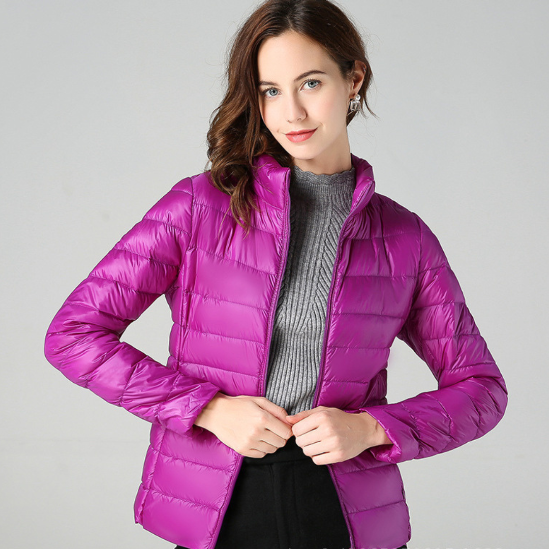 Sleek women's ultralight waterproof jacket. Stylish, versatile, and all-weather ready for outdoor or casual use.