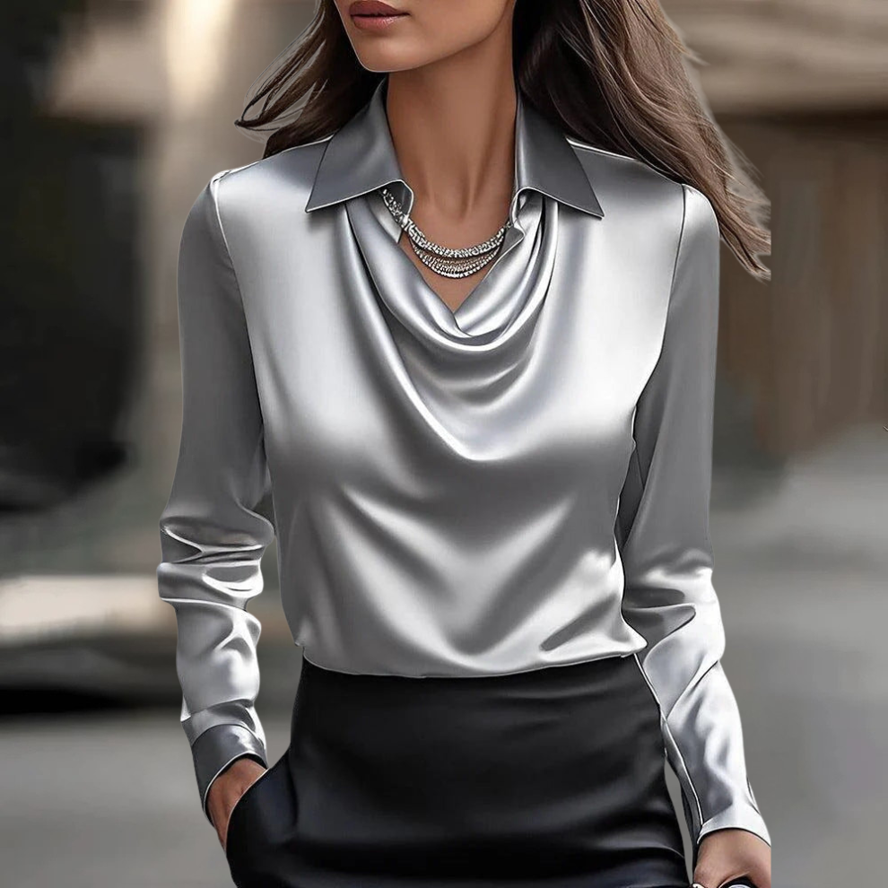 Chic women's fashion blouse, ideal for work or evening events. Versatile & comfortable fit.