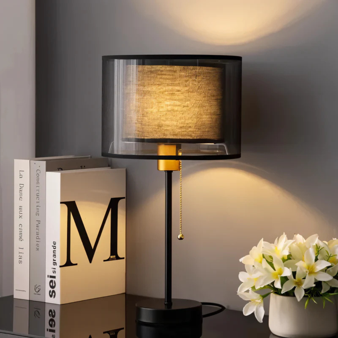 Warm ambient LED table lamp with a unique double fabric shade, ideal as a vintage bedside or reading light.