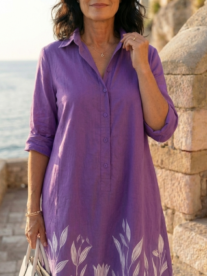 Women's relaxed fit purple botanical print dress with a stylish collar and three-quarter sleeves.