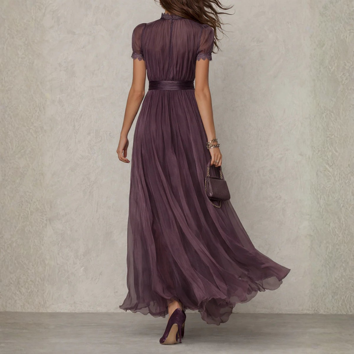 Women's formal purple maxi dress with delicate lace trim. Ideal long party dress or sophisticated evening wear.