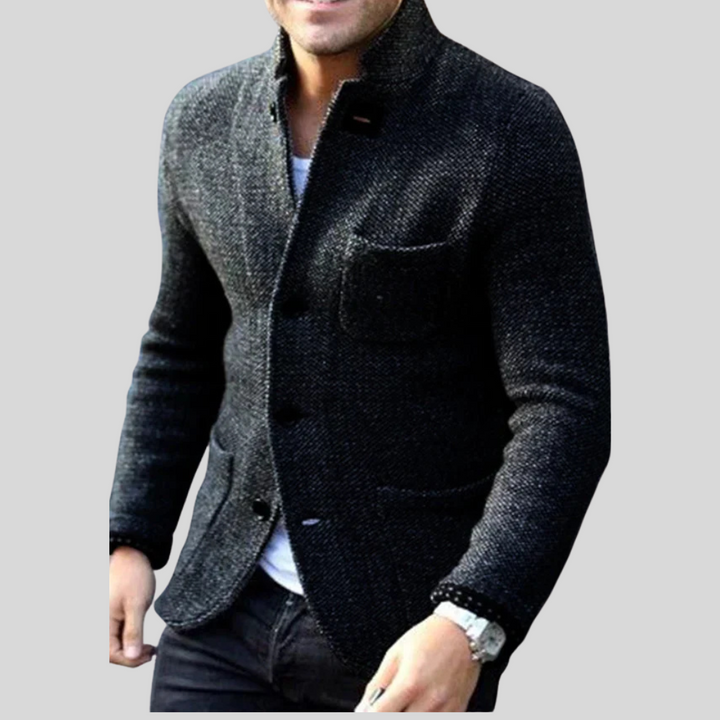 Close-up of a men's modern quilted blazer, showcasing its texture and button-front for a smart layered winter look.