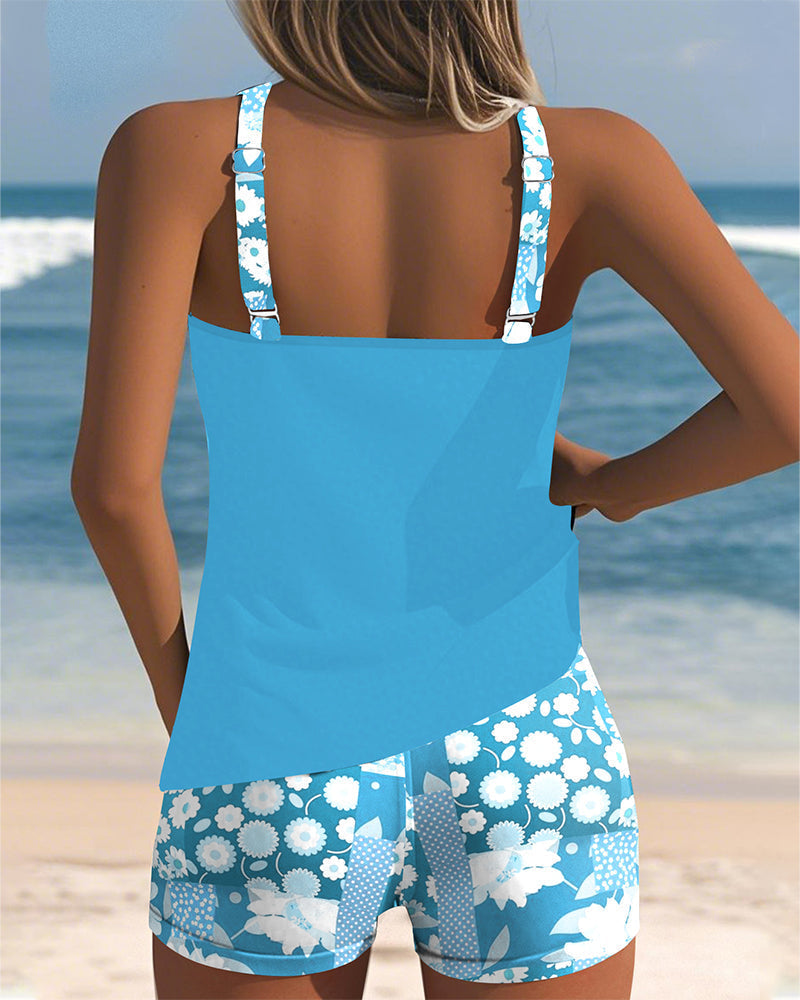 Comfortable women's printed two-piece swimsuit set with a stylish tank top and shorts.