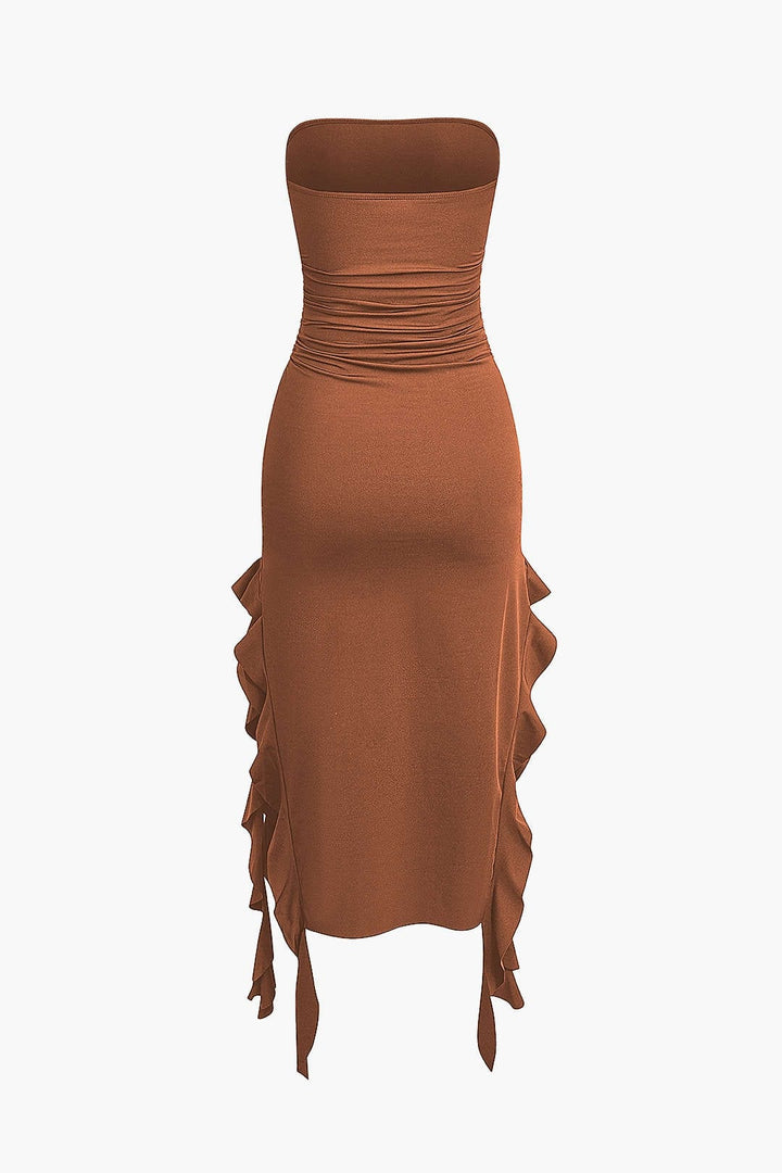 Modern strapless bodycon midi dress with a sophisticated fringe hem, ideal for upscale events.