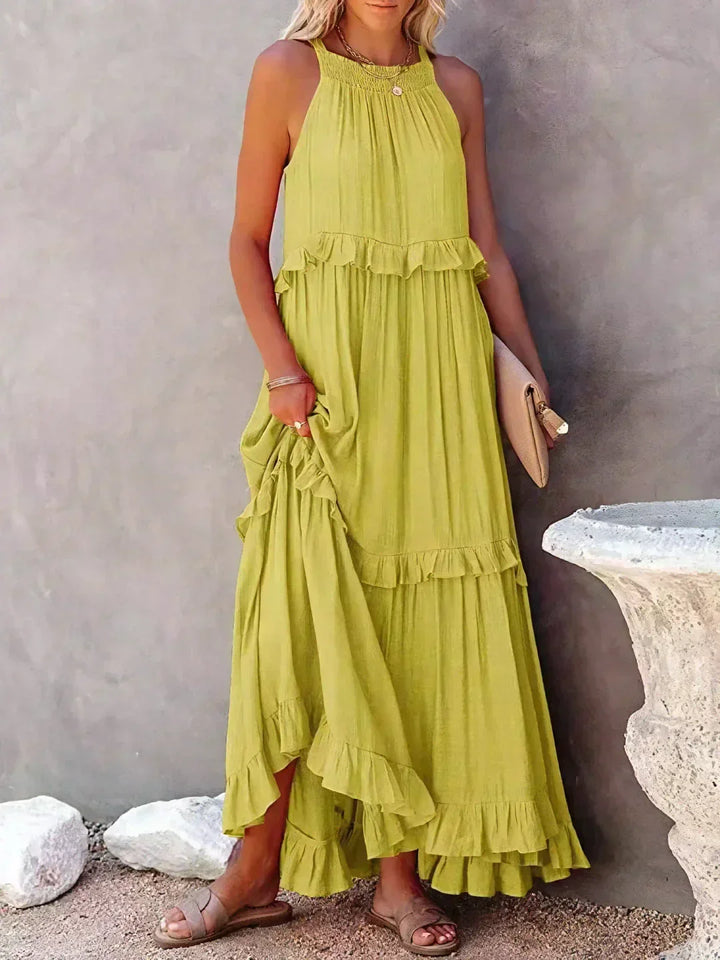 Beautiful purple halterneck ruffle maxi dress with pockets, ideal for vacation.