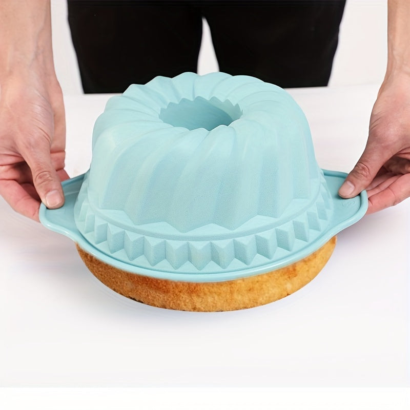 Hand easily removing a cake from a flexible, nonstick silicone baking mold. Effortless release.