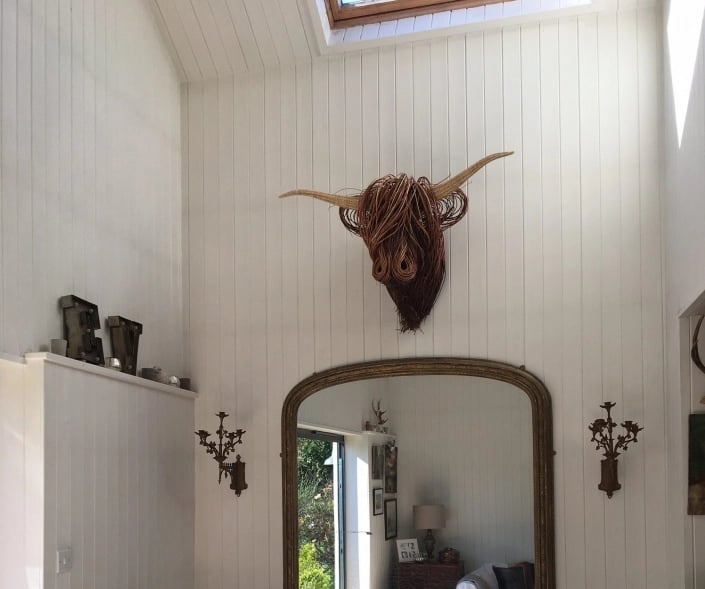 Toro Rustic Wall Sculpture, handwoven rattan art, natural texture, animal inspired boho decor.
