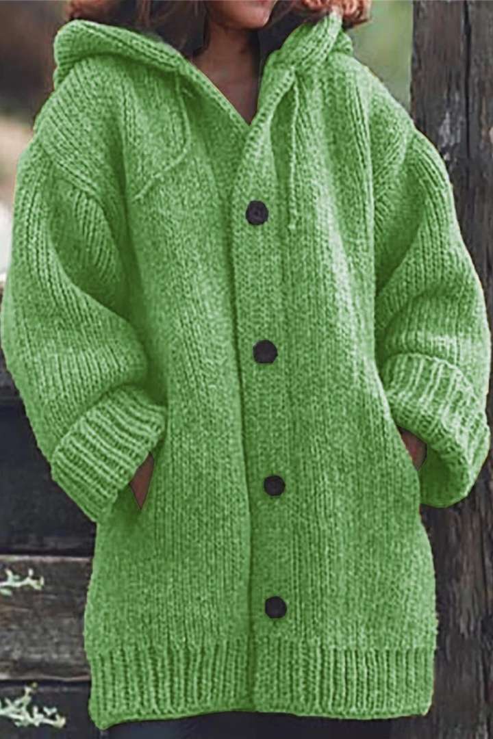 Warm oversized hooded cardigan for women, an essential cozy outerwear piece for effortless winter style.