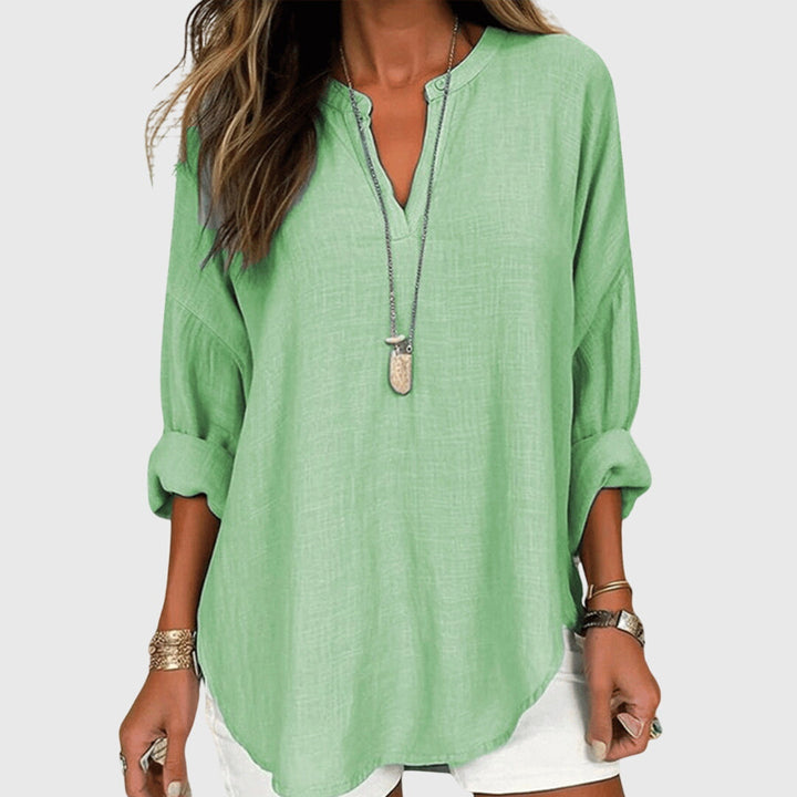Oversized women's elegant blouse, a stylish and casual flowing shirt for beach days.