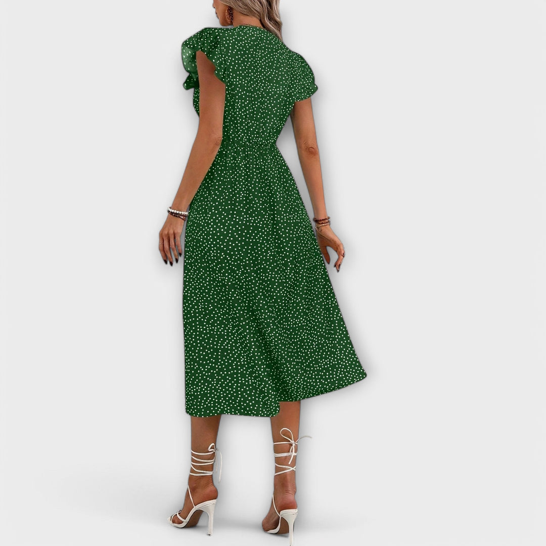 Sophisticated women's elegant A-line dress with a playful polka dot print, great for summer events.
