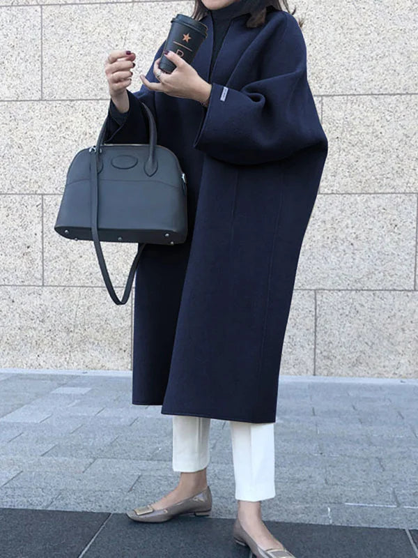 Cozy and elegant women's long black coat, perfect winter outerwear for stylish warmth.