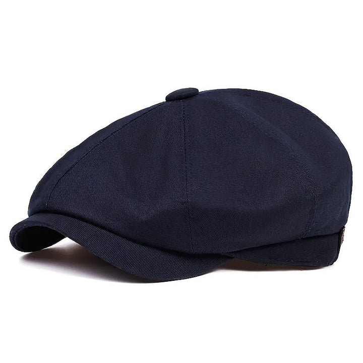 Classic men's herringbone flat cap, vintage design, stylish retro headwear accessory.