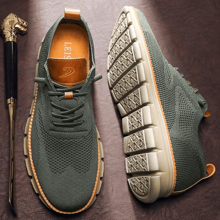 Men's casual lace-up sneakers with perforated design for breathable comfort & style.
