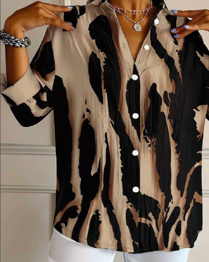 Women's casual stand collar blouse with long raglan sleeves & unique irregular print. Spring/autumn fashion.