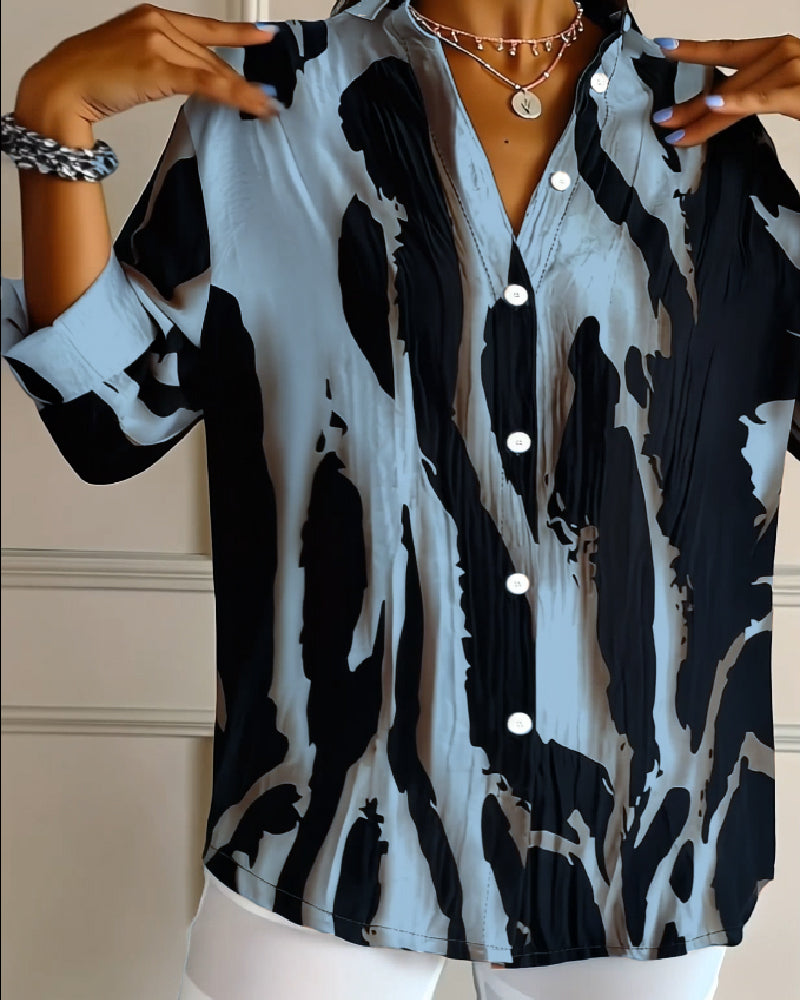 Elegant women's stand collar printed blouse with long raglan sleeves & unique irregular pattern.