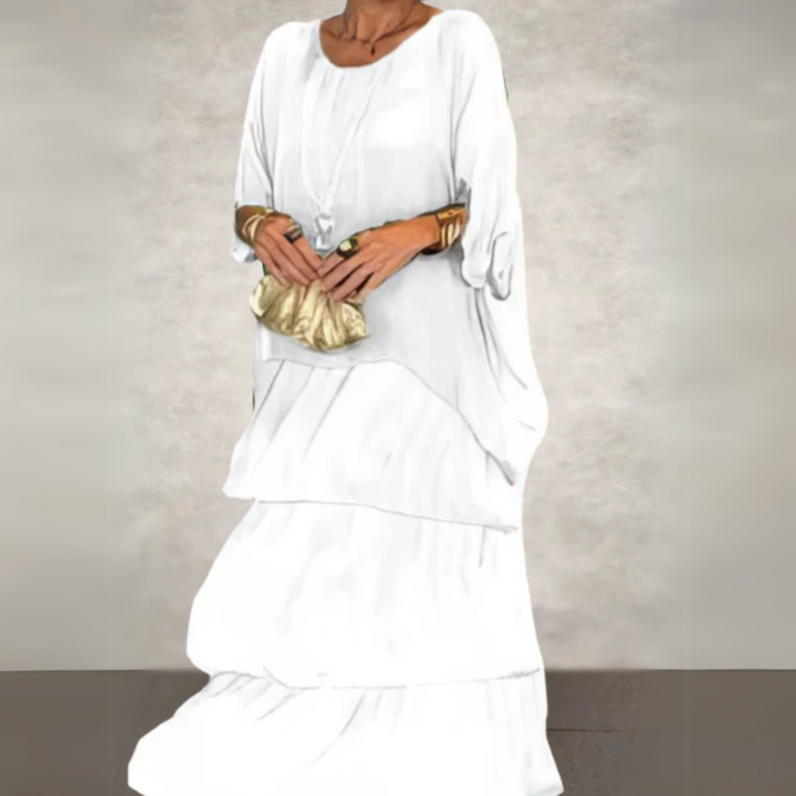 Beautifully printed women's tiered maxi dress with long sleeves, elegant and comfortable for any occasion.