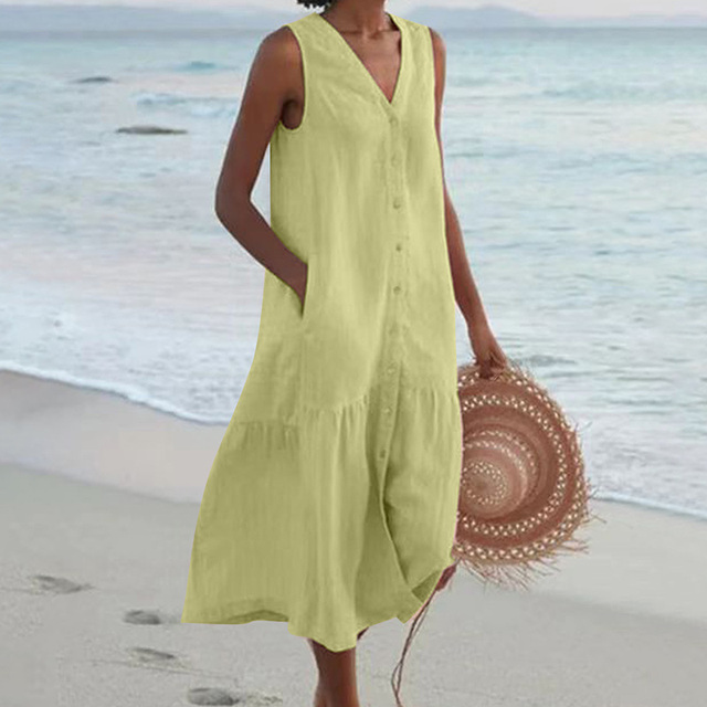 Lightweight flowy women's sleeveless midi dress. Features a button-front and tiered skirt, perfect for summer comfort.