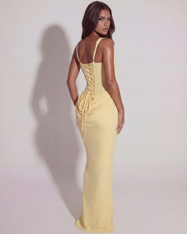 Formal women's yellow maxi dress with a sophisticated lace-up back design.