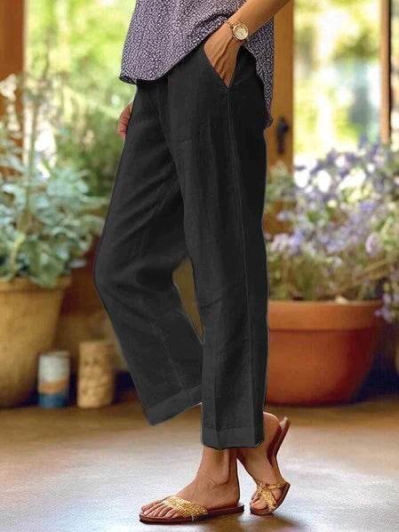 Stylish women's wide-leg flowy pants with elastic waist, perfect for versatile summer casual outfits.
