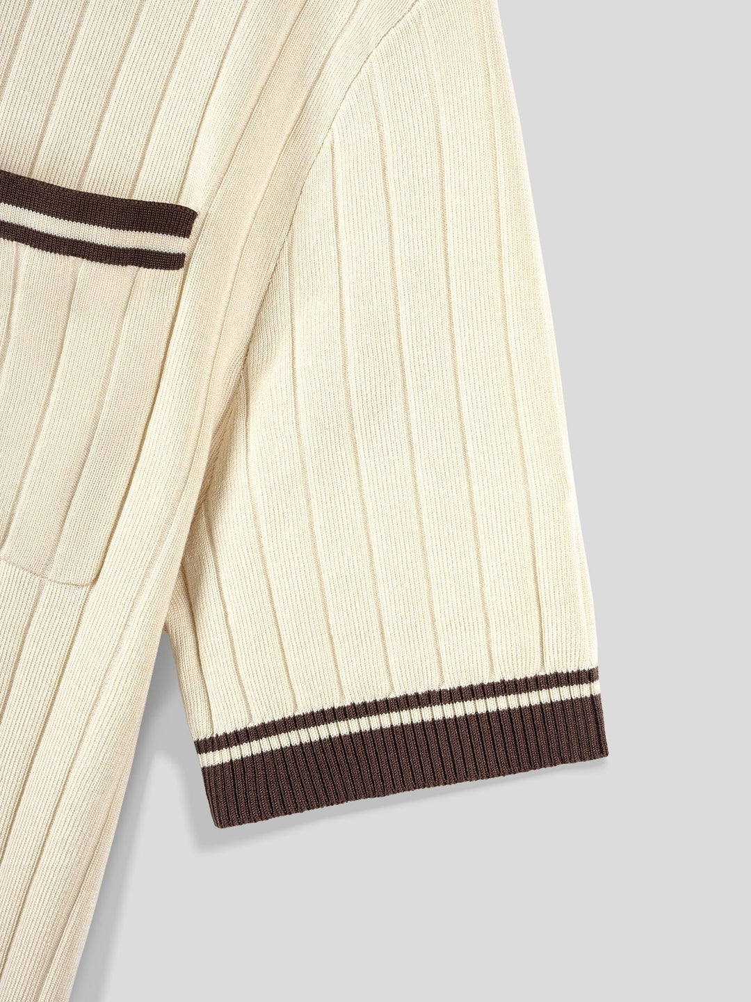 Short-sleeve men's polo tee, ribbed knit texture, beige, finished with a sharp striped trim.