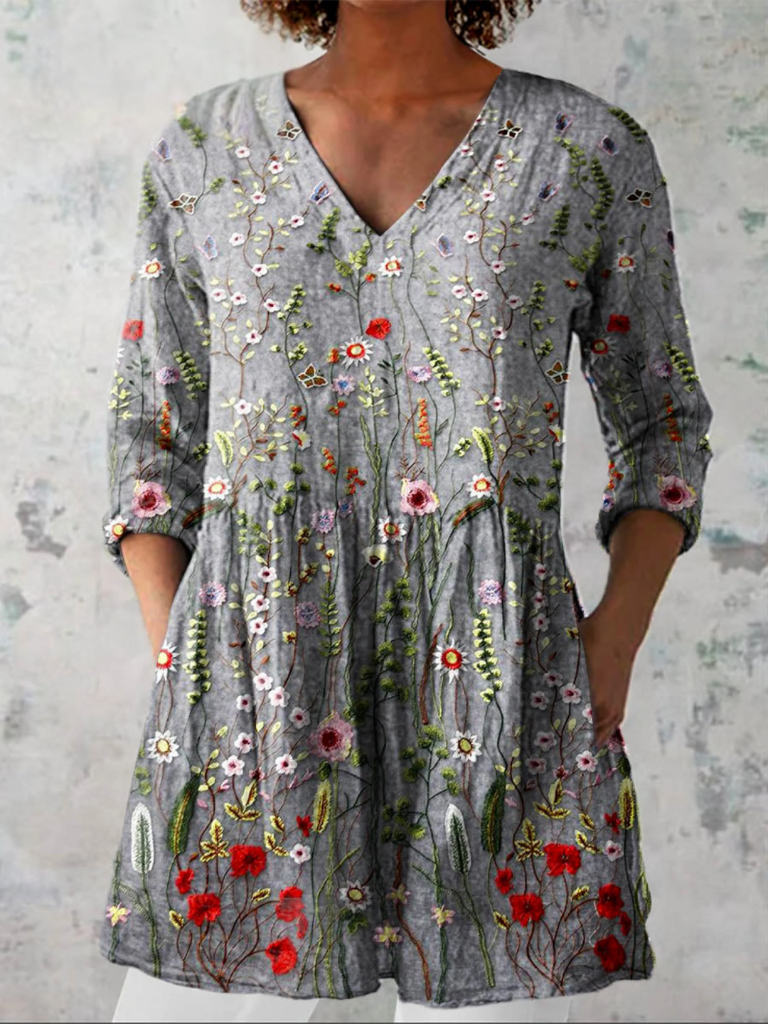 Women's grey v-neck long blouse, offering effortless style & comfortable casual wear. A chic, versatile top.