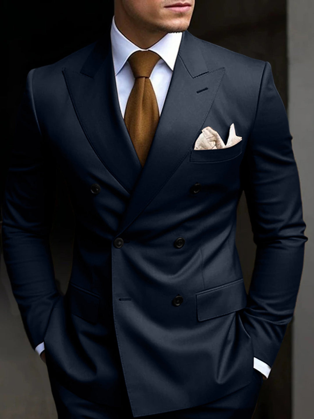 Close-up of a tailored double-breasted men's suit jacket, showing details.