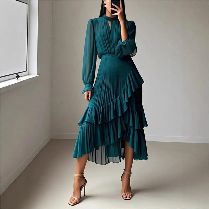 Sophisticated women's flowy midi dress with elegant pleats & a high neckline. Party-ready.