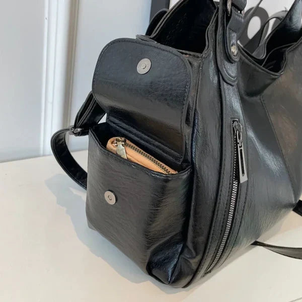 Front view of a women's sophisticated faux leather tote shoulder bag, a must-have fashion accessory.