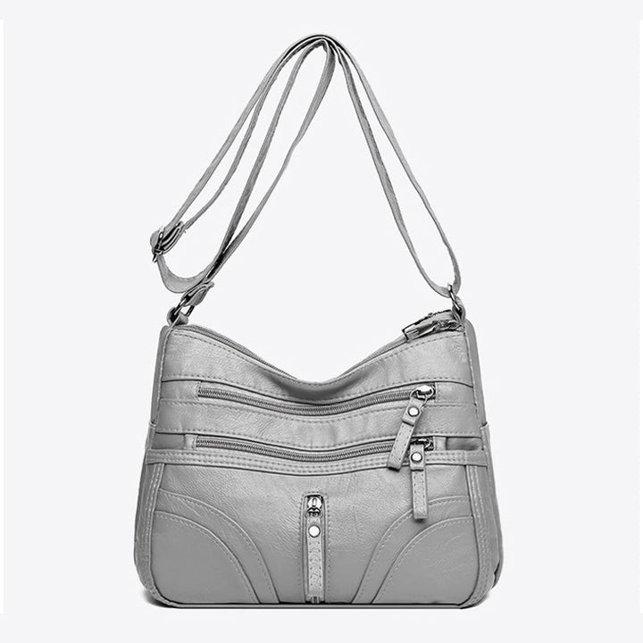 Relaxed fit women's crossbody bag, vintage faux leather for versatile everyday wear.