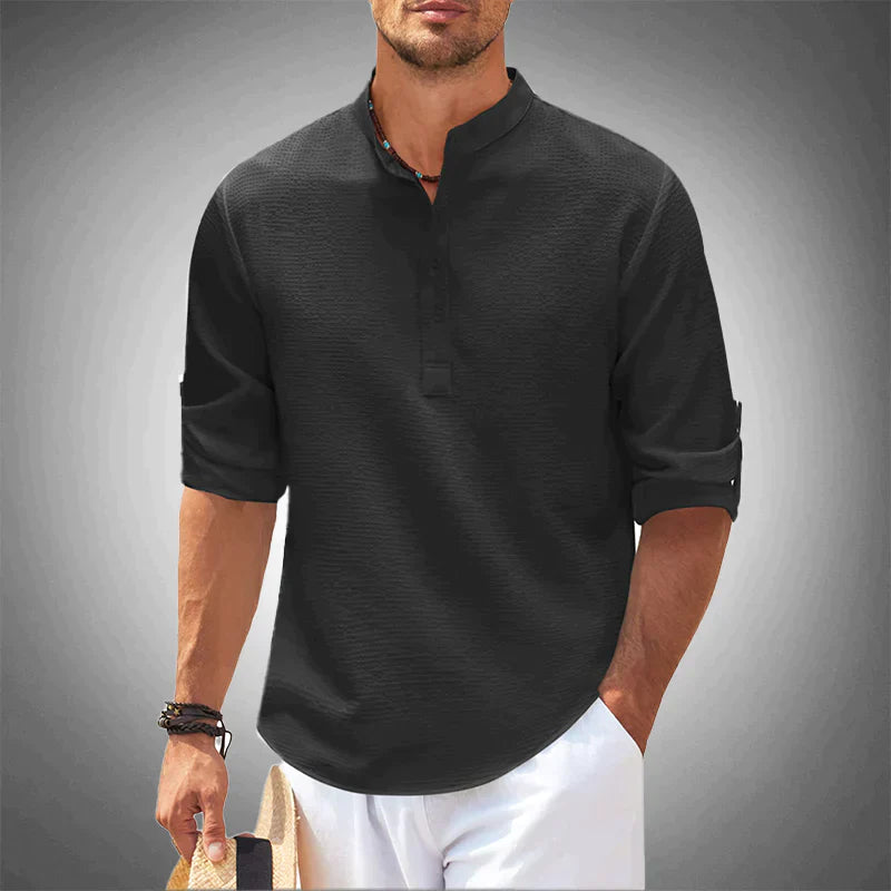 Modern gentleman wearing a classic men's button-down long-sleeve shirt, exuding effortless style for any occasion.