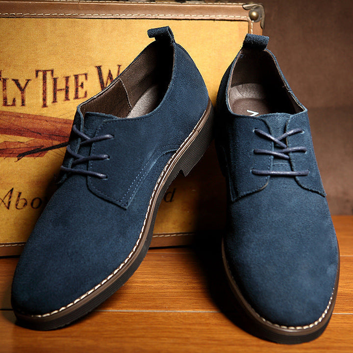 Stylish blue men's lace-up dress shoes, a modern twist for business attire & elegant fashion. Versatile & comfortable work shoes.