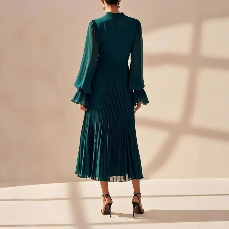 Beautiful women's elegant midi dress, pleated and flowing, a chic choice for any event.