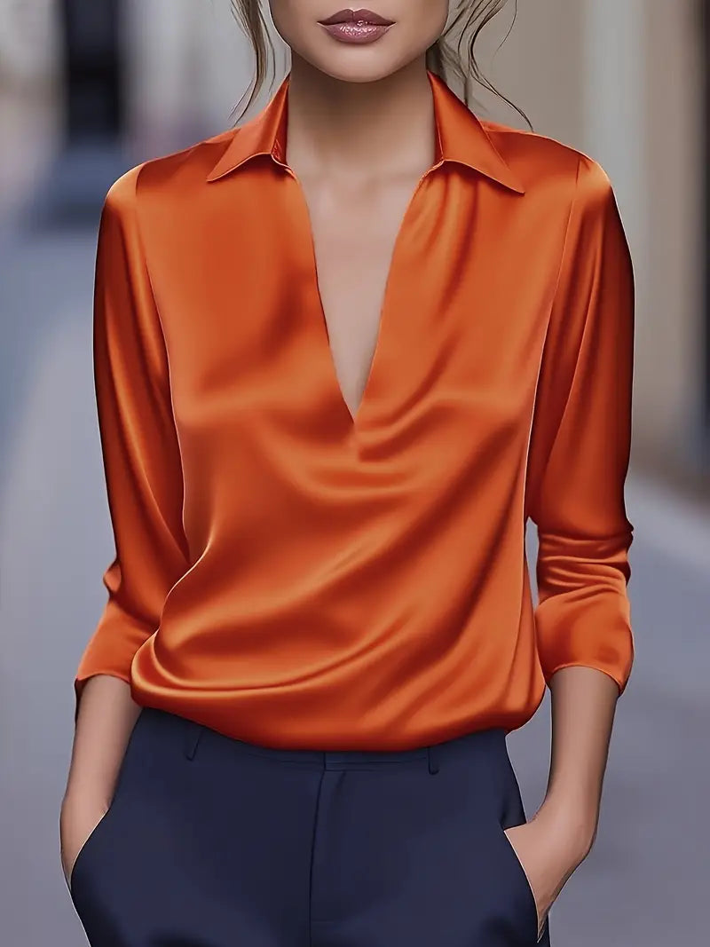 Classic women's long sleeve blouse with a V-neck and collar. A versatile fashion staple for any occasion.