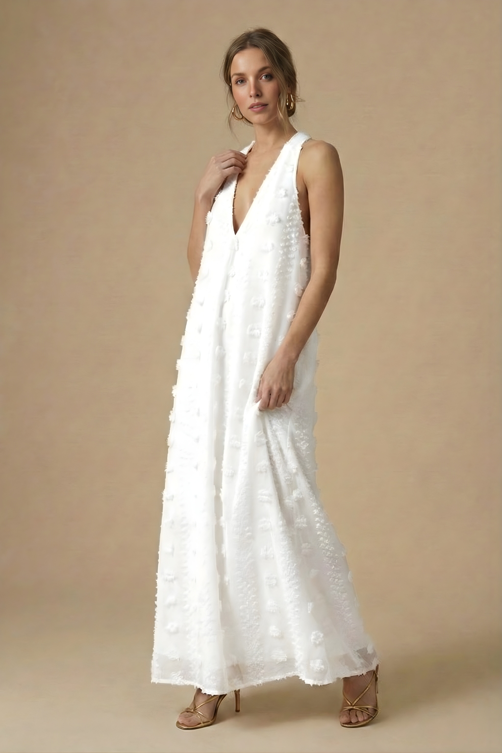 Flowing women's maxi dress with a stylish halter neckline, backless design, and intricate 3D floral embellishments.