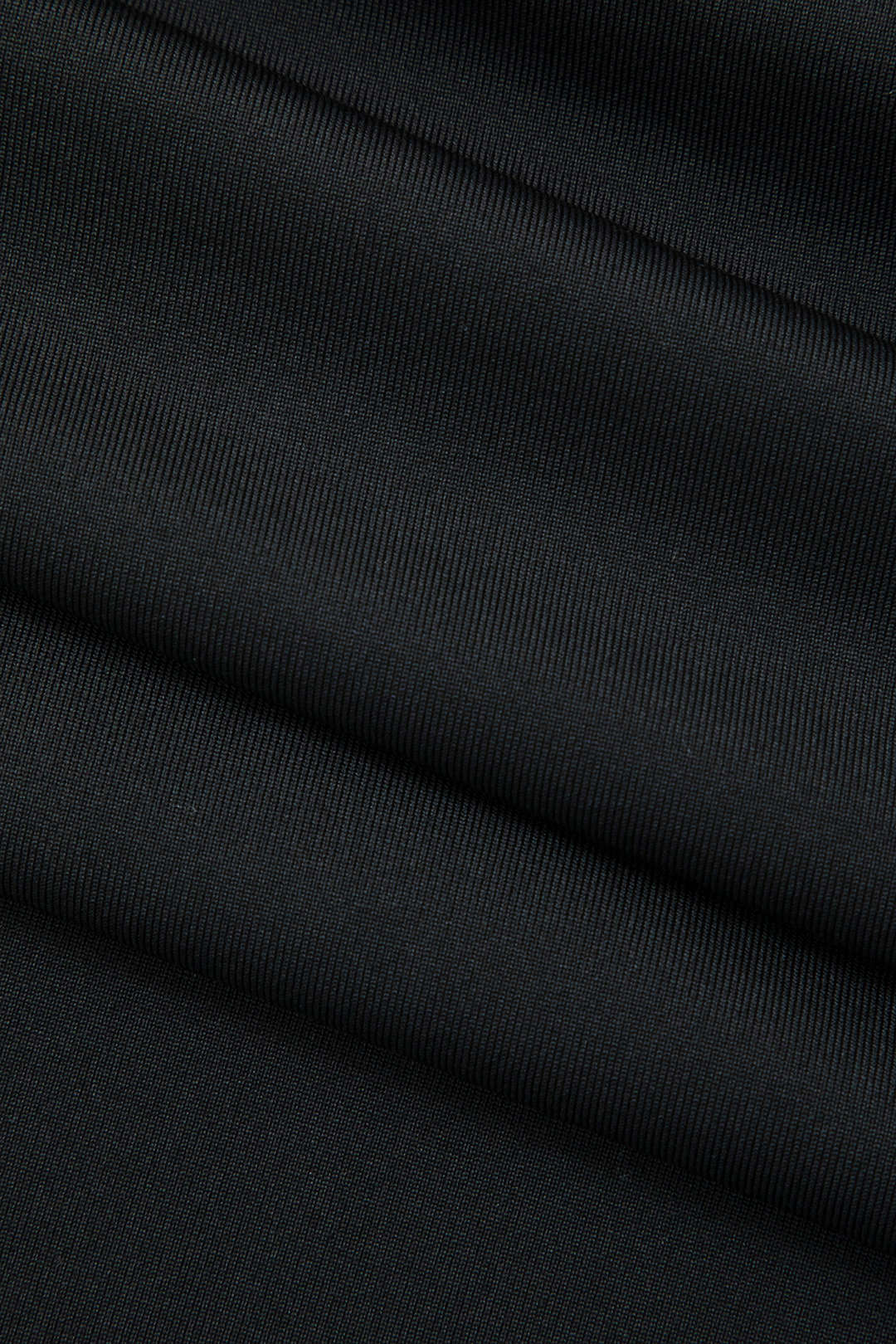 Modern strapless bodycon midi dress, featuring a unique fringe hem, perfect for cocktails.